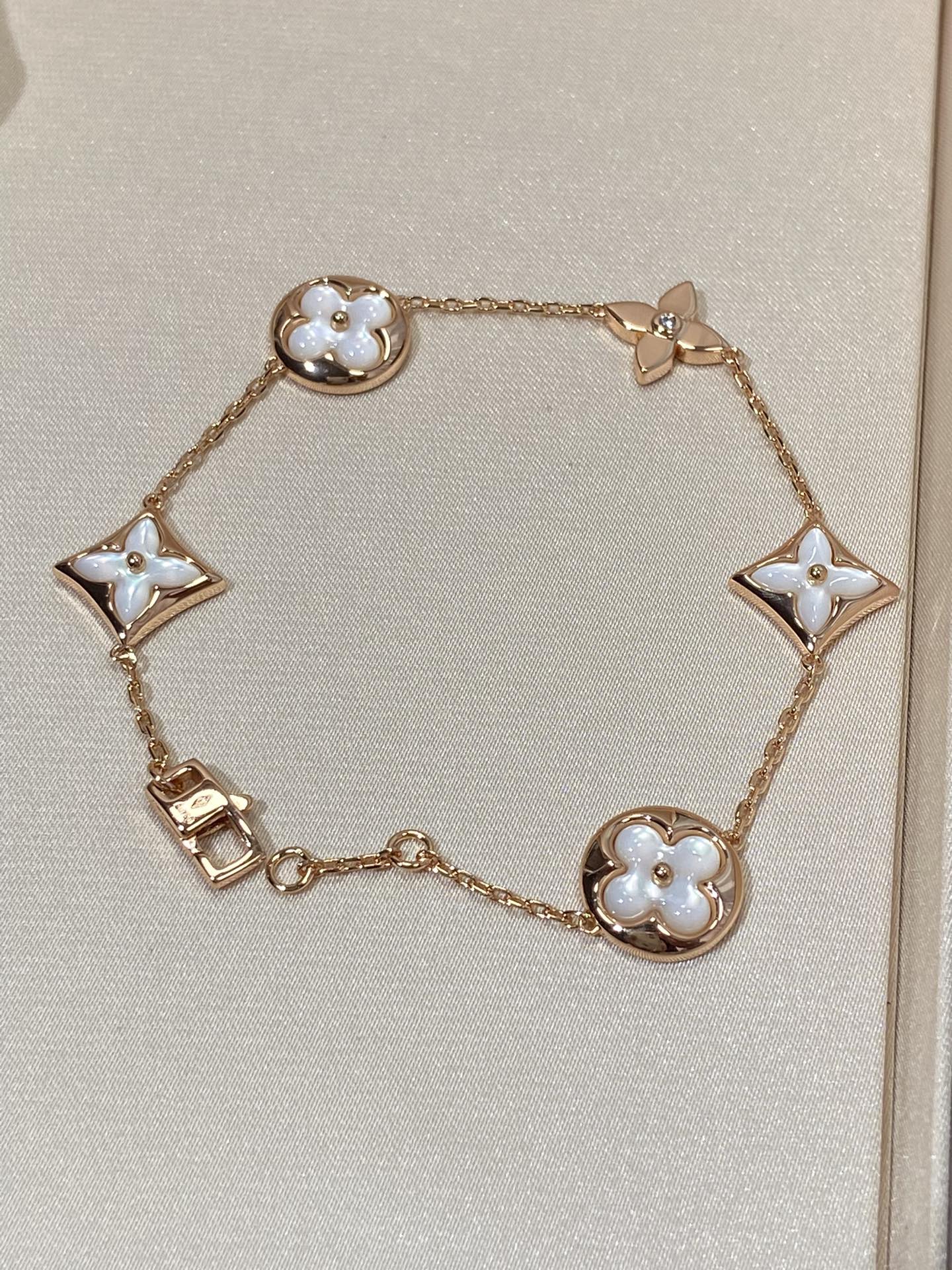 [RAFFINE]STAR AND SUN 5 MOTIF MOP PINK GOLD BRACELET