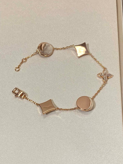 [RAFFINE]STAR AND SUN 5 MOTIF MOP PINK GOLD BRACELET