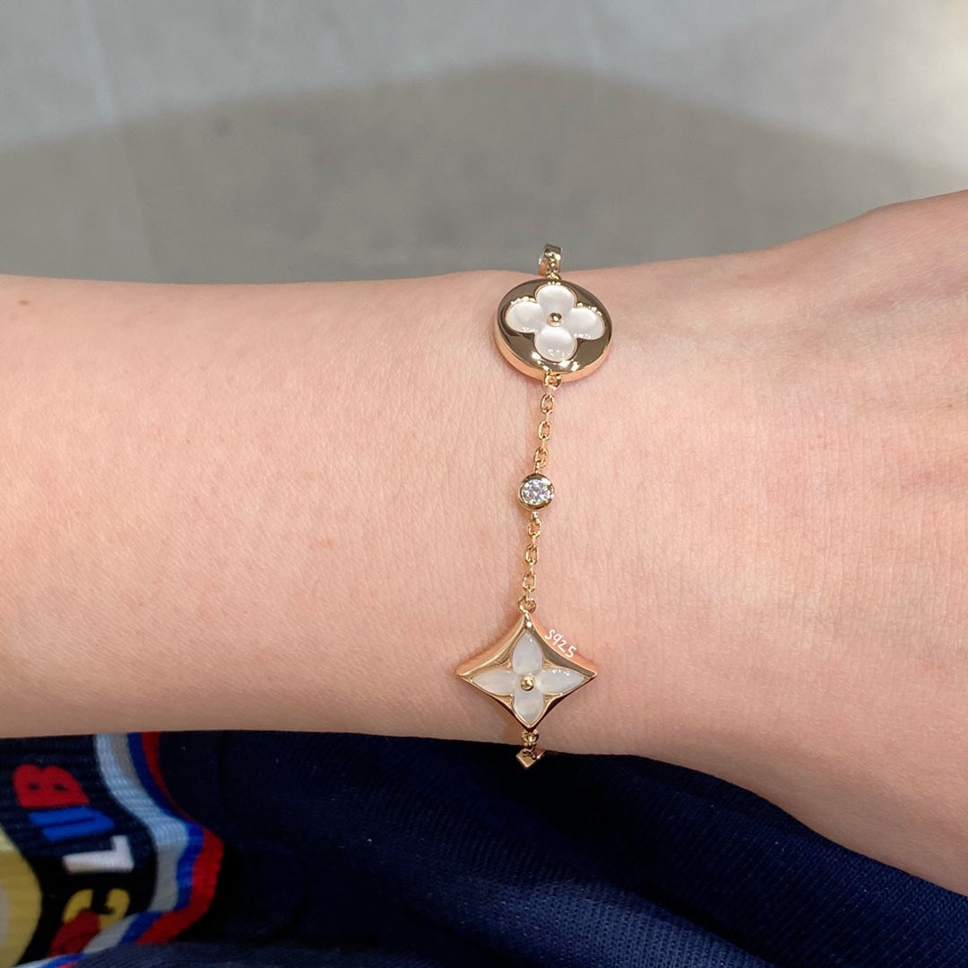 [RAFFINE]STAR AND SUN 4 MOTIF WHITE MOP PINK GOLD BRACELET