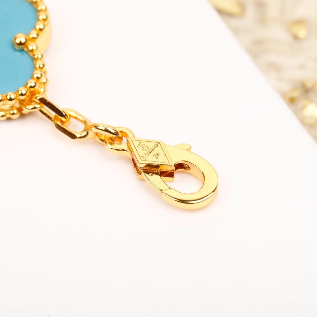 [RAFFINE] PULSERA DE ORO CON 5 MOTIVOS DE TRÉBOL, TURQUESA Y DIAMANTE